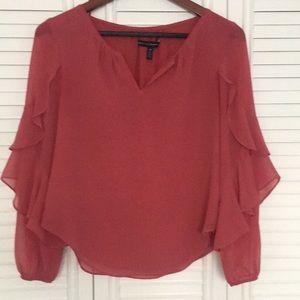 Flowing crepe top mauve/peach color. Very cool top